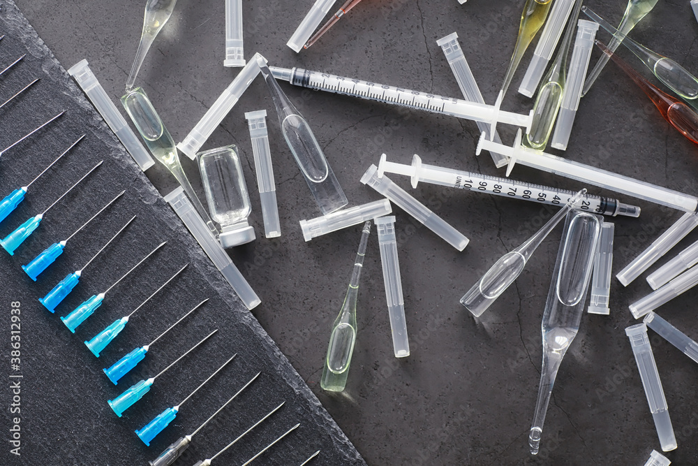 Test tubes with drugs and tests to test the victims and treat the infected. Ampoules with medicines. Set of test tubes with medicine. Test tubes with drugs and tests to test the victims and treat the infected. Ampoules with medicines. Set of test tubes with medicine.