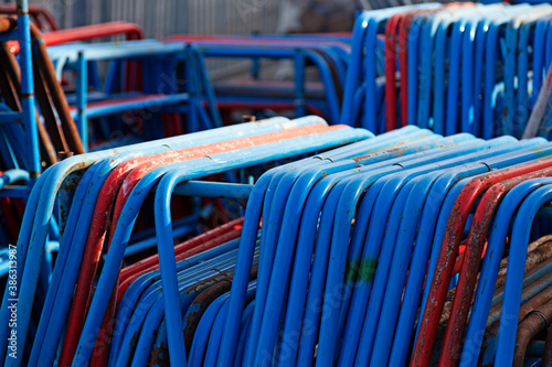lots of metal frames in blue and orange used in construction