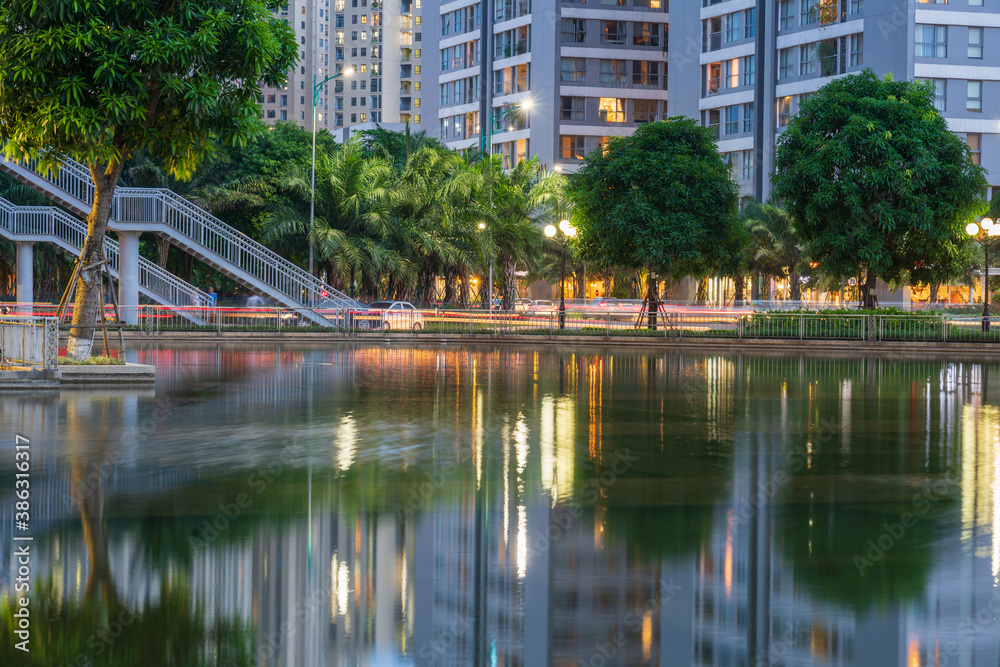 Illuminated building facades with reflection on lake Illuminated building facades with reflection on lake