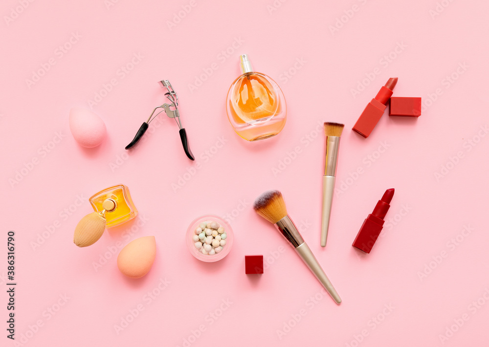 Set of makeup brushes with decorative cosmetics on color background Set of makeup brushes with decorative cosmetics on color background