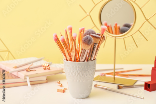 Set of makeup brushes on dressing table