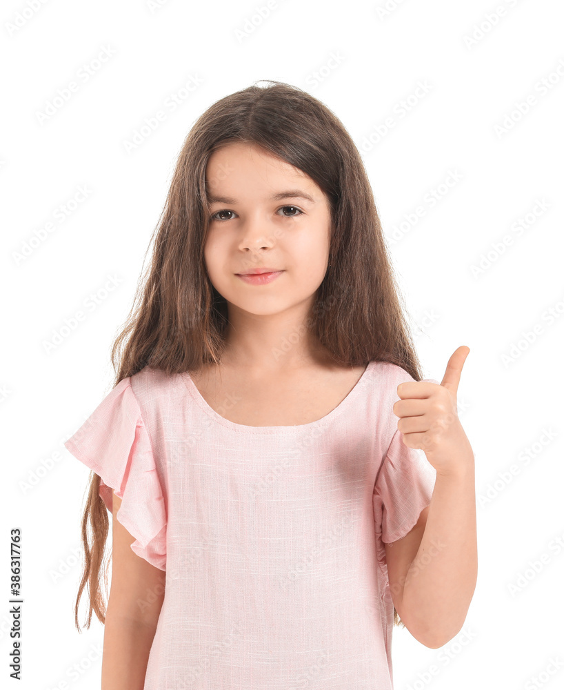 Cute little girl showing thumb-up gesture on white background Cute little girl showing thumb-up gesture on white background