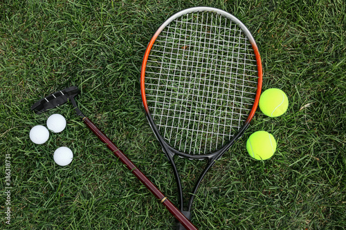 Set of sport equipment on green grass © Pixel-Shot