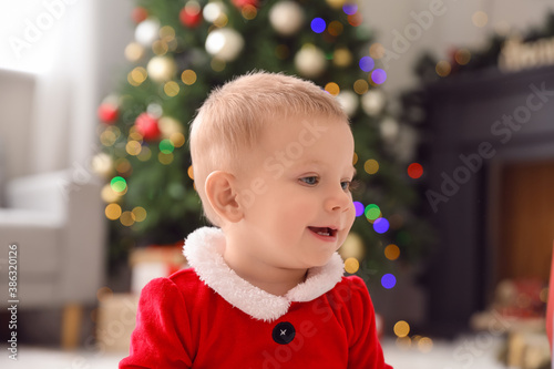 Cute little baby in Santa c...