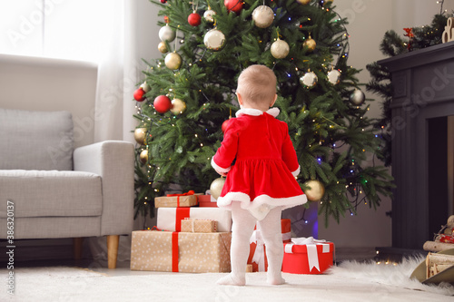 Cute little baby in Santa c...