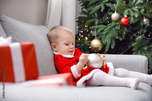 Cute little baby in Santa c...