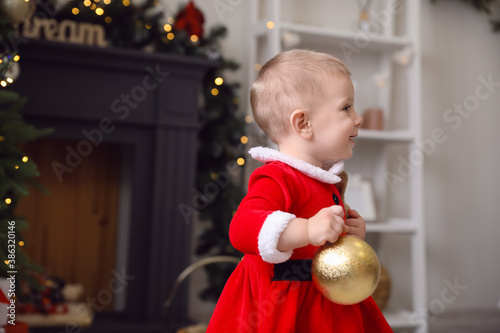 Adorable baby dressed in sa...