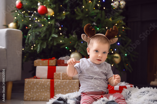 Cute little baby with deer ...