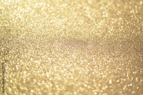Sparkling gold bokeh background, gold color. Gold sequins background.