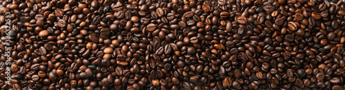 Pile of coffee beans on white background, top view