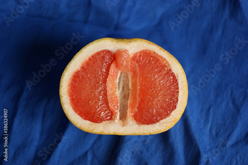 vulva, clitoris and labia symbol. Grapefruit looks like a vulva (vagina), with the clitoris and labia. Female genitalia concept