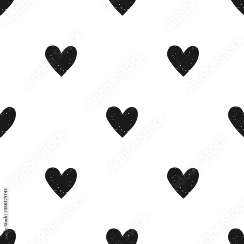 Valentine's Day block print seamless pattern with grunge textured black hearts on white background