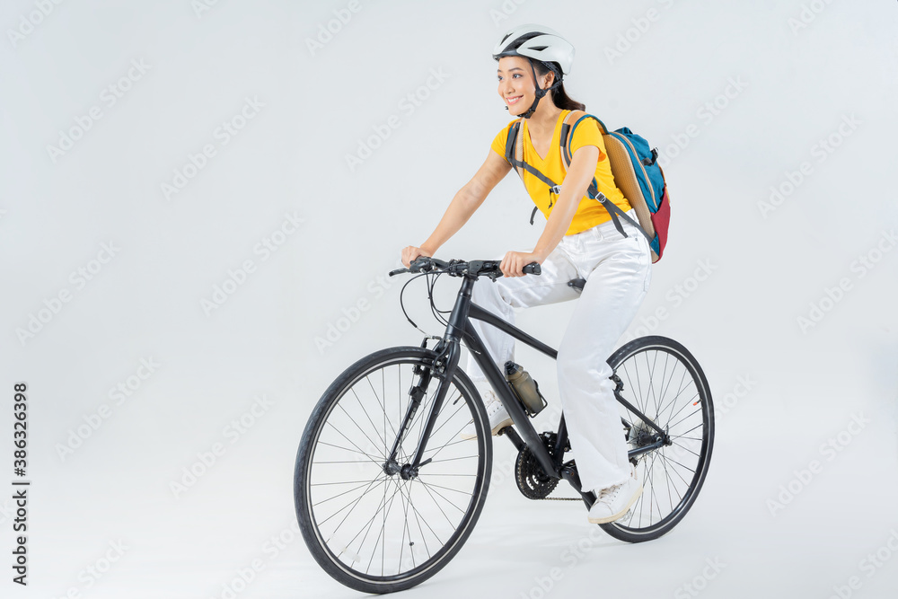 Asian beautiful woman, she is riding a city bike to work. Asian beautiful woman, she is riding a city bike to work.