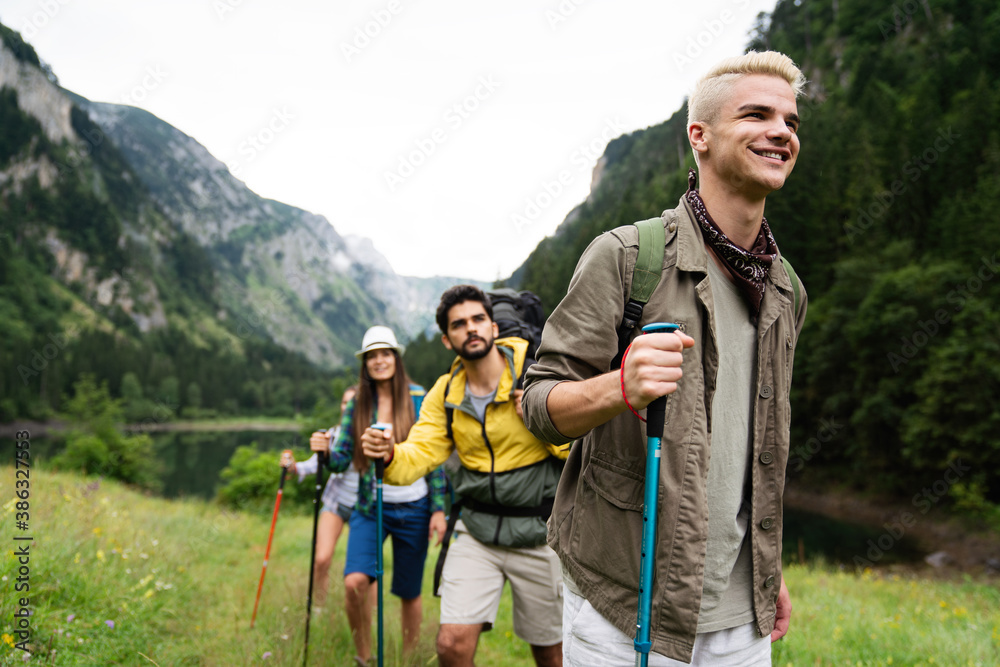 Group of friends on a hiking, camping trip in the mountains