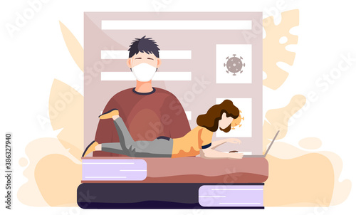 A girl with a laptop lies on books and works or studies on her computer from home during COVID-19. Online learning with a poster about the need to prevent the spread of coronavirus. Quarantine