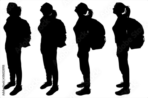 Tourists with backpacks on their backs. Side view, profile. Girls on a hike. Hiking. The women stand still, not moving and looking up, forward. Black female silhouette isolated on white background.