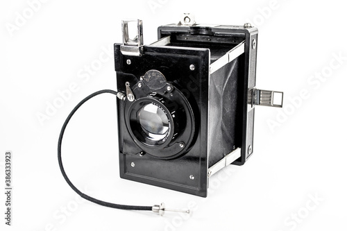 Vintage photo camera on the white background photo