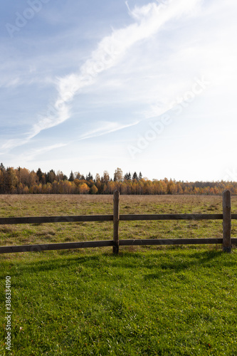 beautiful view of the field with a fence. life in a village