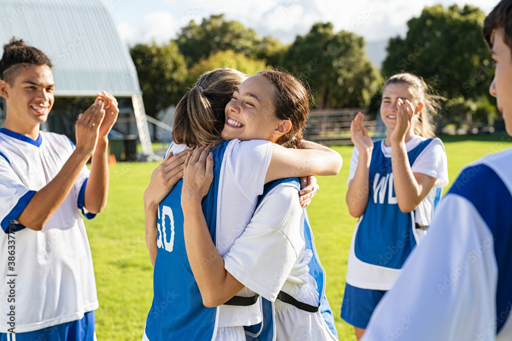Fototapeta premium Girls soccer players celebrating victory