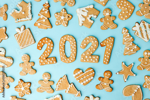 Winter Holiday pattern - set of gingerbread on light blue background - man in mask, house, xmas tree, stars and Number Happy New Year 2021, Merry Christmas background, trendy concept