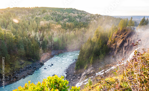 snowqualmie fall at sunset with a lot of fog. photo