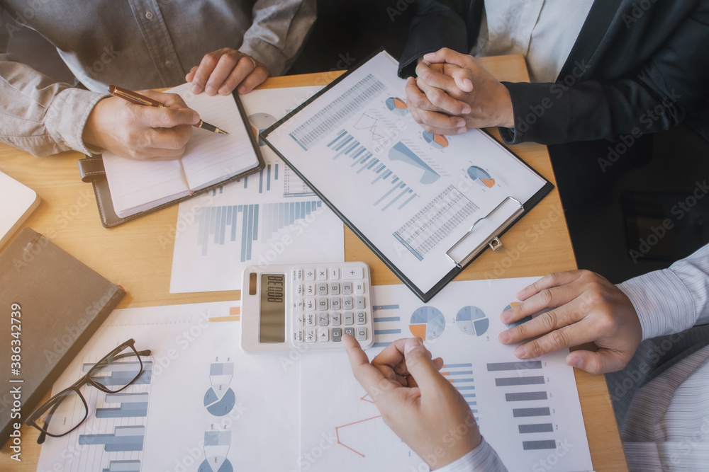 Business sales consultant discussing in data documents at modern office. Business sales consultant discussing in data documents at modern office.
