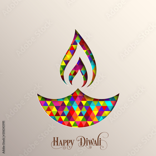Happy Diwali greeting card with intricate calligraphy and illuminated Diwali lamp.