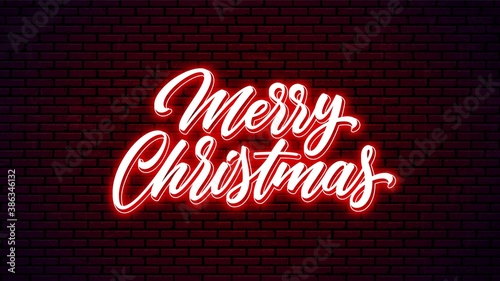 Merry Christmas neon hand drawn lettering. Glowing holiday calligraphy.