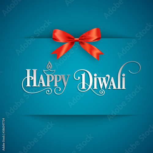 Happy Diwali greeting card with intricate calligraphy and illuminated Diwali lamp.
