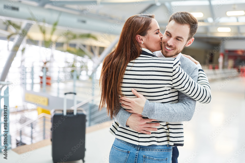 Happy couple gives a kiss and hugs each other Stock Photo | Adobe Stock