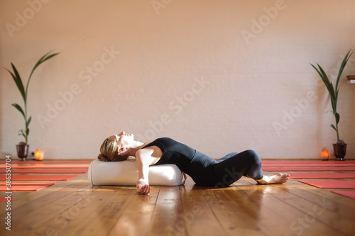 Fotobehang Woman practicing yoga at home during quarantine