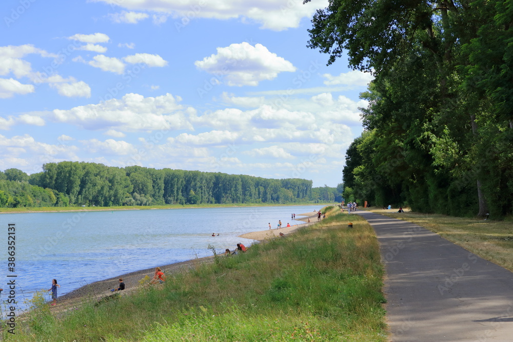 July 09 2020 - Germersheim/Germany: people swimming in rhine river and are relaxing