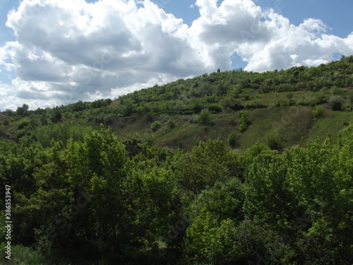
road along fields and hills in the Saratov region, Russia