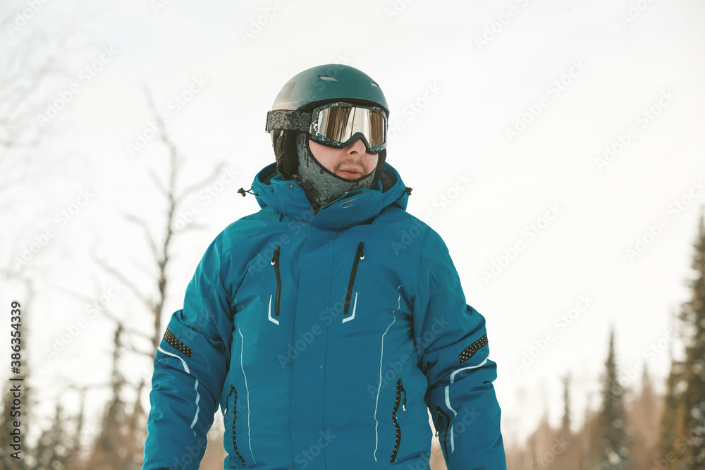 Close up of man snowboarder in snowy forest Close up of man snowboarder in snowy forest