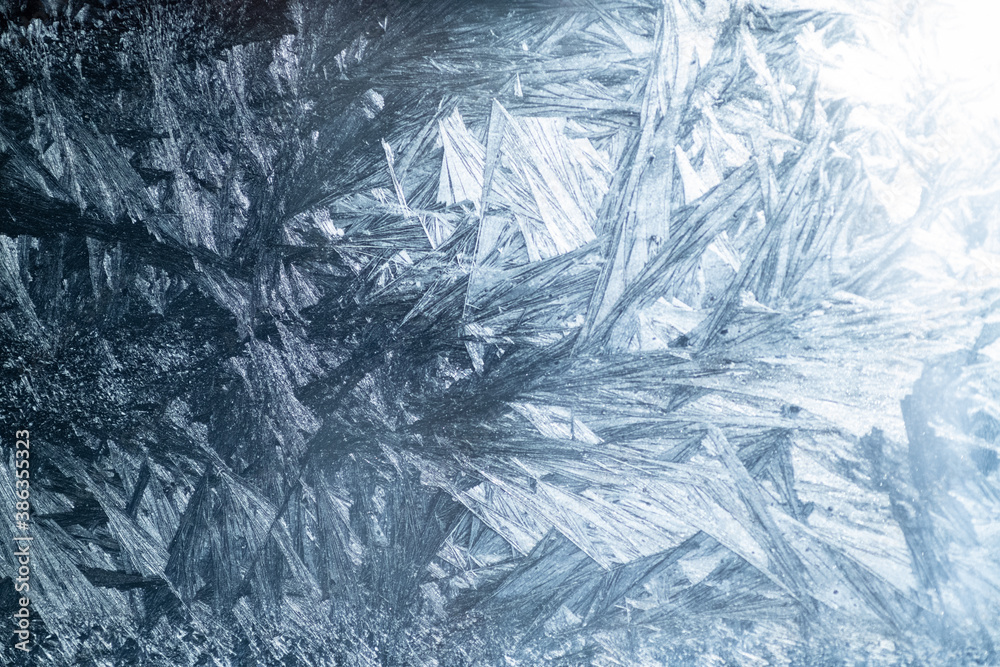 Winter colorful background with icy frost patterns Winter colorful background with icy frost patterns