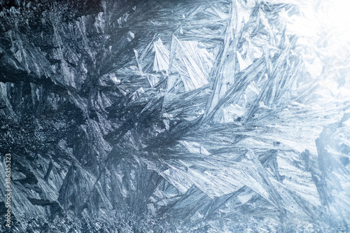 Winter colorful background with icy frost patterns