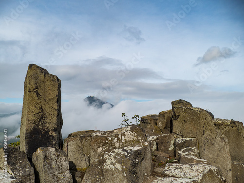 milesovka mountain seen from ostry above morning fog photo