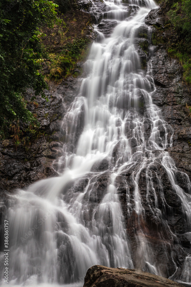 Beautiful natural Sarika waterfall with rocks in the foreground at Khao Yai National Park, Nakhon Nayok, Thailand