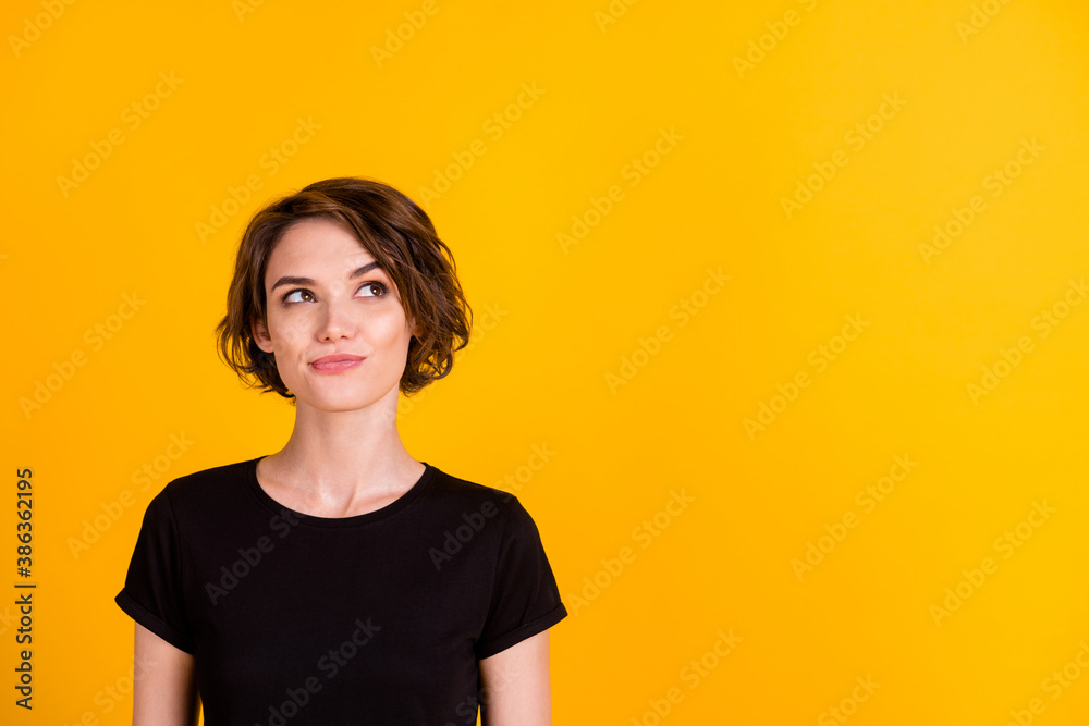 Close-up portrait of lovely curious smart girl wearing cotton t-shirt overthinking copy space isolated over vibrant yellow color background