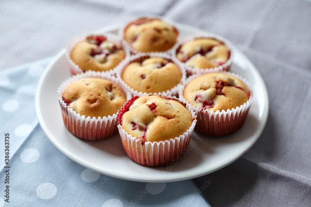 Homemade dessert - strawberry muffins on white plate
