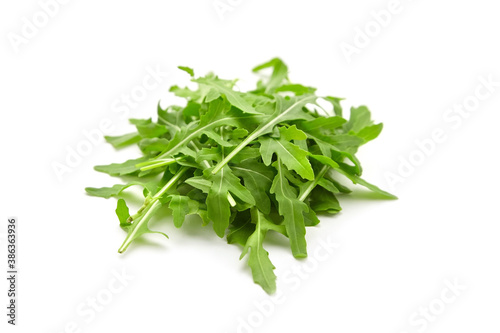 Fresh arugula or rucola leaves closeup isolated on white background