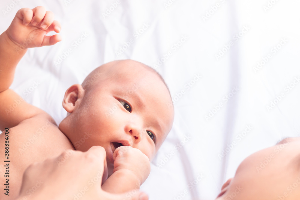 Happy family mother playing with newborn baby. Happy family mother playing with newborn baby.