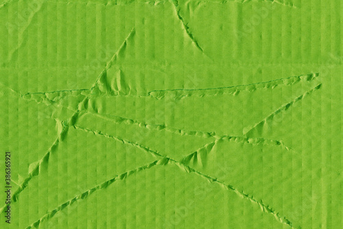 A green vintage rough sheet of carton. Recycled environmentally friendly cardboard paper texture. Simple and bright minimalist papercraft background.