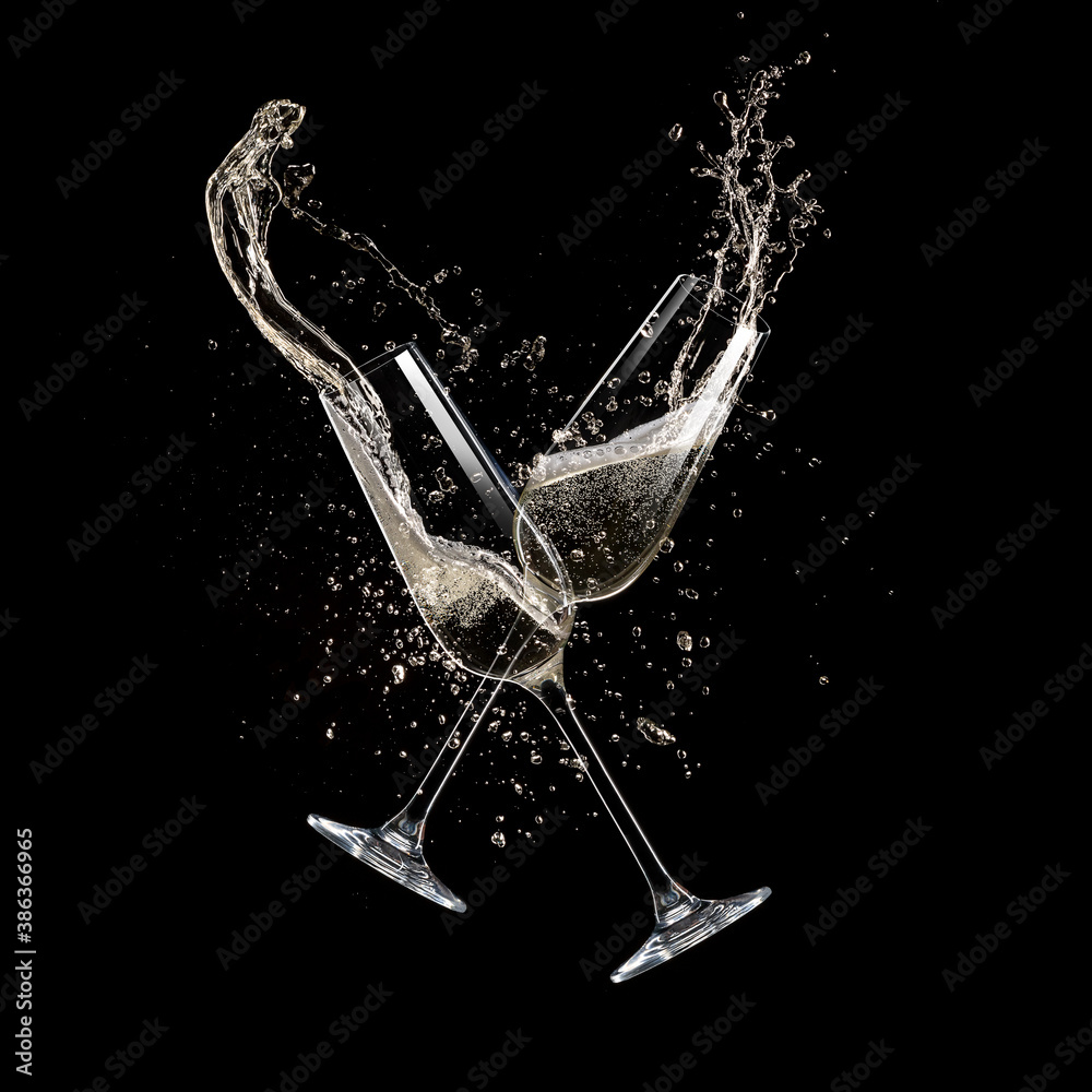 Glasses of champagne levitating in the air, celebration theme. - obrazy, fototapety, plakaty 