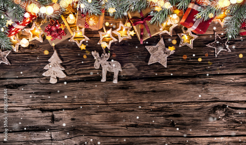 Christmas decoration on wooden background, lots of copy space for your product or text. © Lukas Gojda