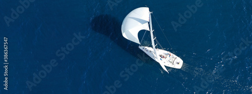 Fotografie, Obraz Aerial drone ultra wide panoramic photo of beautiful sailboat with white sails c