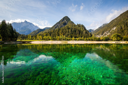 crystal clear lake Jasna with mountains in background