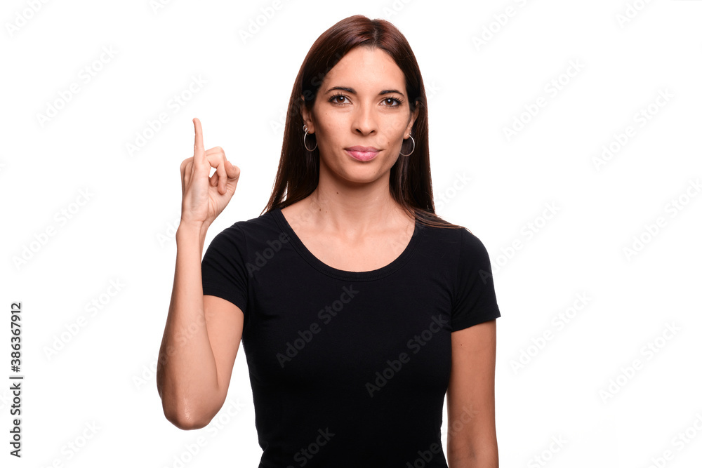 Isolated in white background brunette woman saying letter I in spanish sign language Isolated in white background brunette woman saying letter I in spanish sign language
