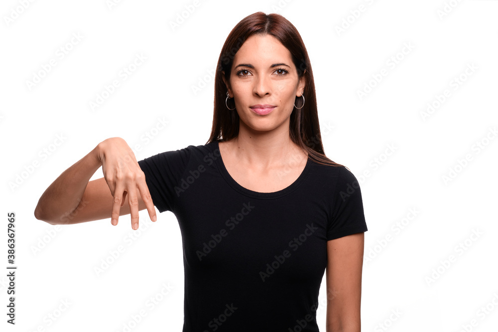Isolated in white background brunette woman saying letter M in spanish sign language Isolated in white background brunette woman saying letter M in spanish sign language
