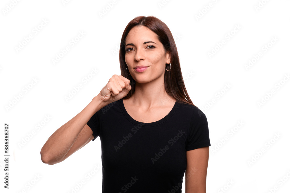 Isolated in white background brunette woman saying sing in spanish sign language Isolated in white background brunette woman saying sing in spanish sign language